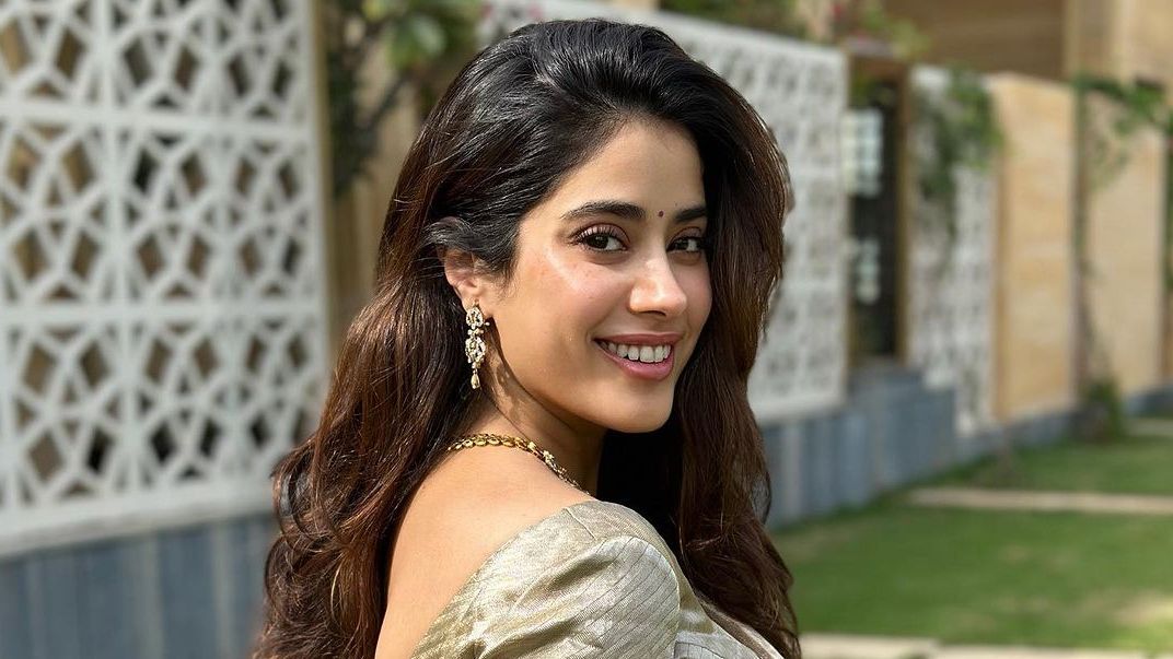 Janhvi Kapoor in a golden Kanchipuram silk sari stands as the quintessential festive look