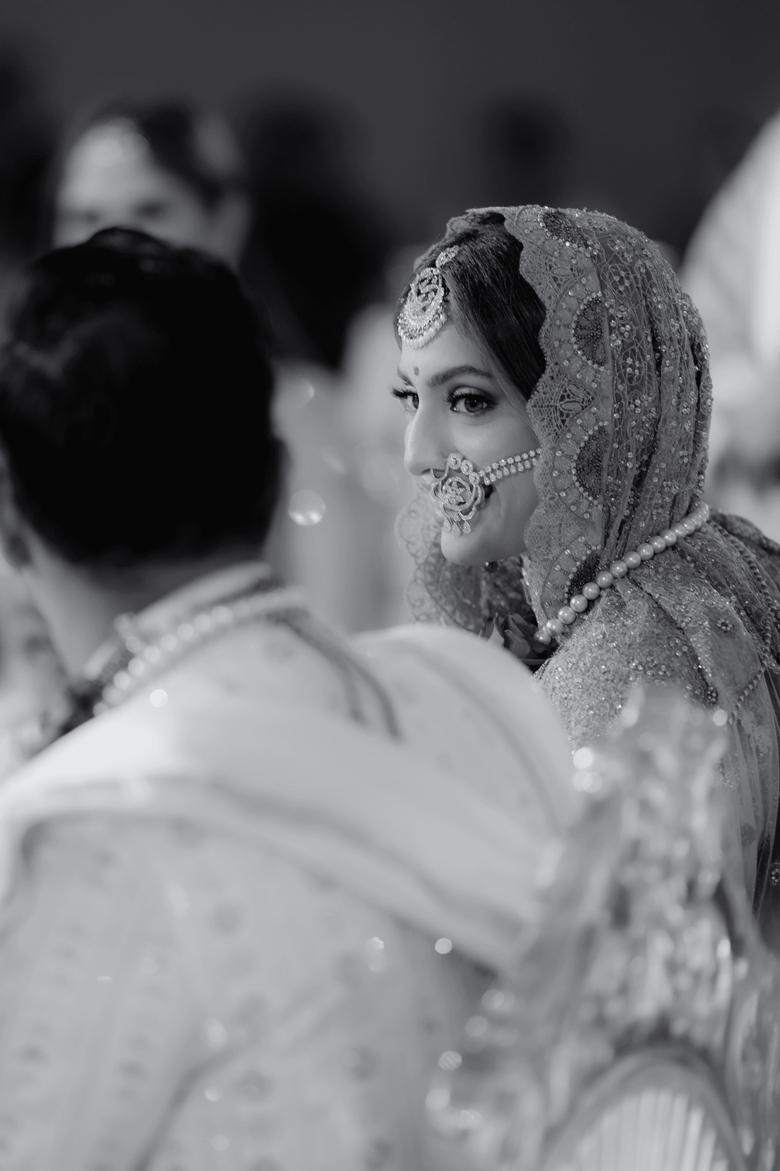 Image may contain Adult Person Wedding Clothing Dress Face Head Formal Wear and Accessories