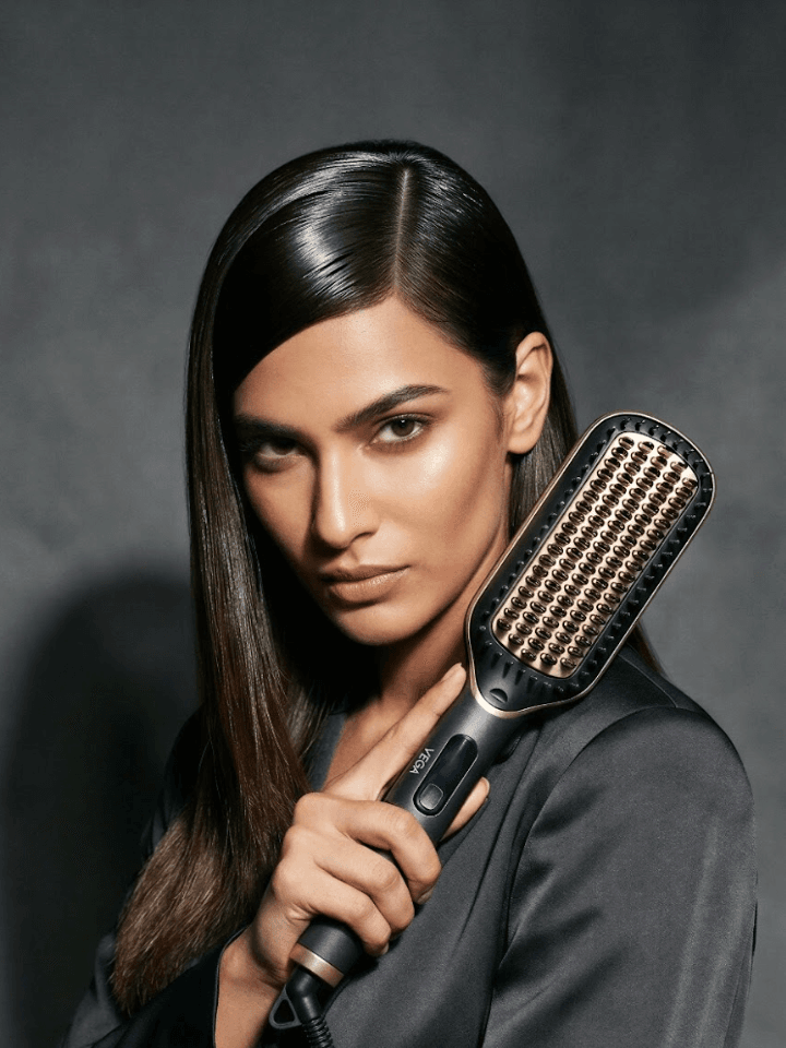 Image may contain Black Hair Hair Person Electrical Device Microphone Adult Face Head Photography and Portrait